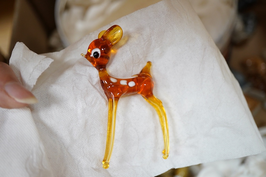 A large collection of Wade Whimsies including Disney Characters and a collection of blown glass animal figures